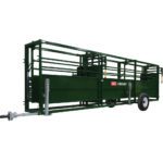 A green trailer with a large metal rack.