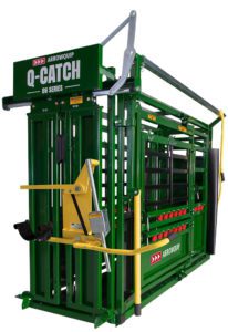 A green and yellow cattle loading cage with the words " q-catch ".