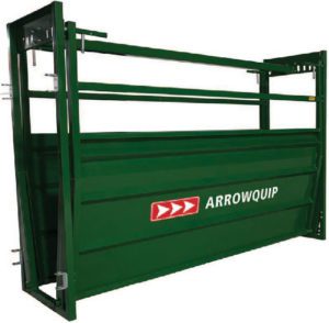 A green cattle loading ramp with arrows on it.
