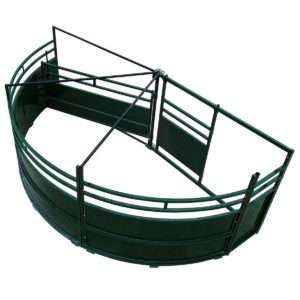 A green cattle pen with metal rails.